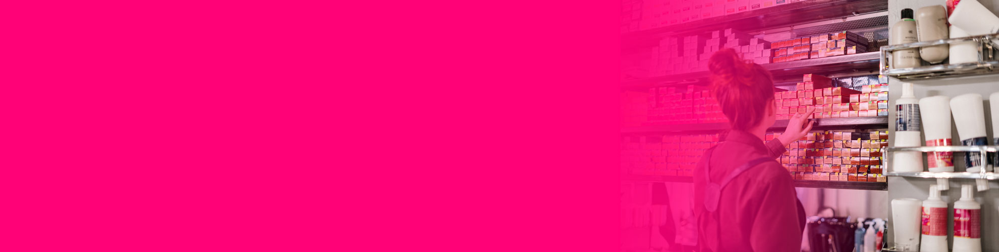 Person choosing item from shelf at Alan Howard store