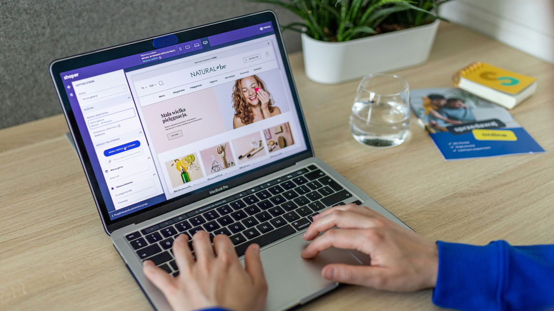person editing ecommerce site on laptop
