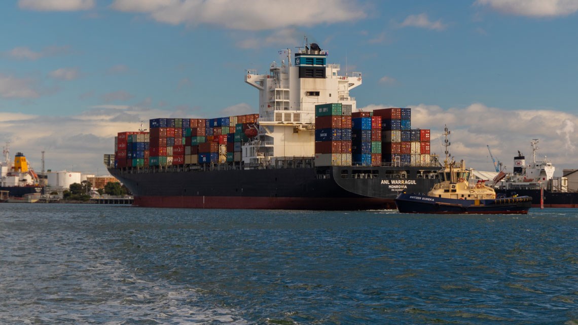 Tanker carrying shipping containers