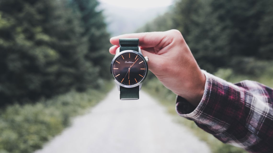 man holding watch