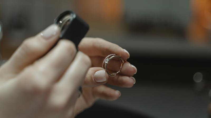 person looking at ring