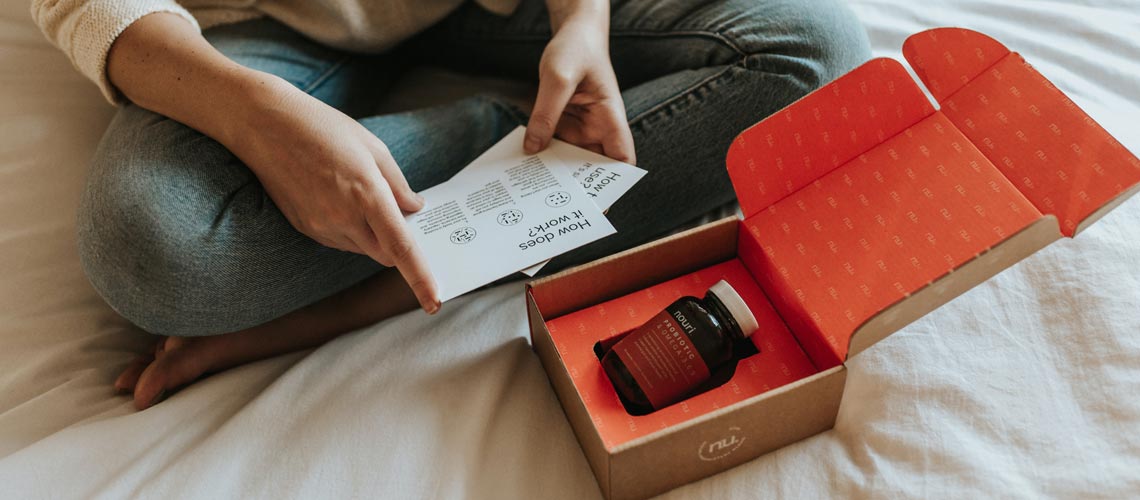 woman looking at supplement delivery