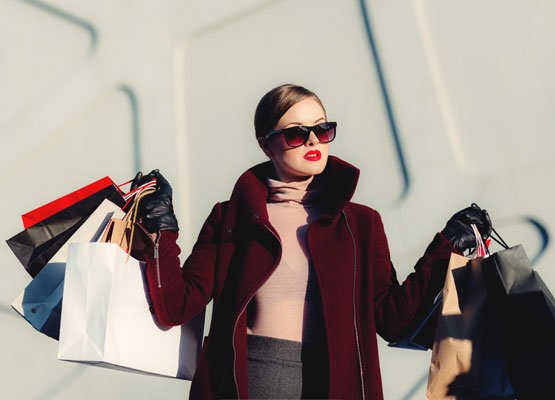 retail, ecommerce, solutions Woman holding bags of shopping