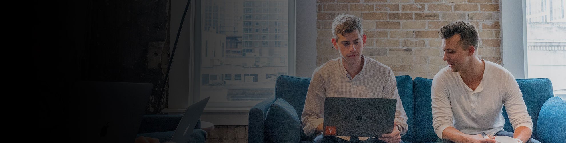 People looking at a laptop