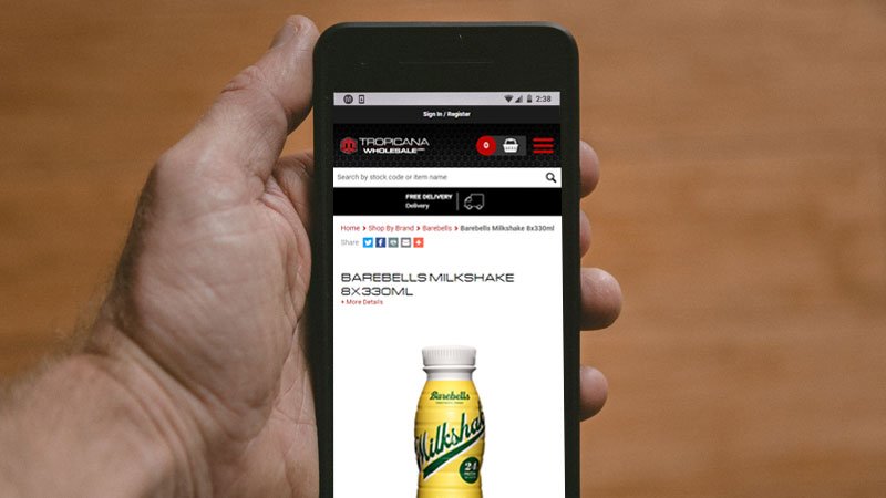 Tropicana Wholesale ecommerce site on a mobile phone
