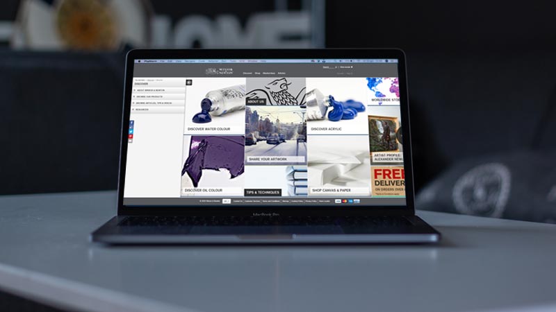 Winsor & Newton ecommerce site on laptop